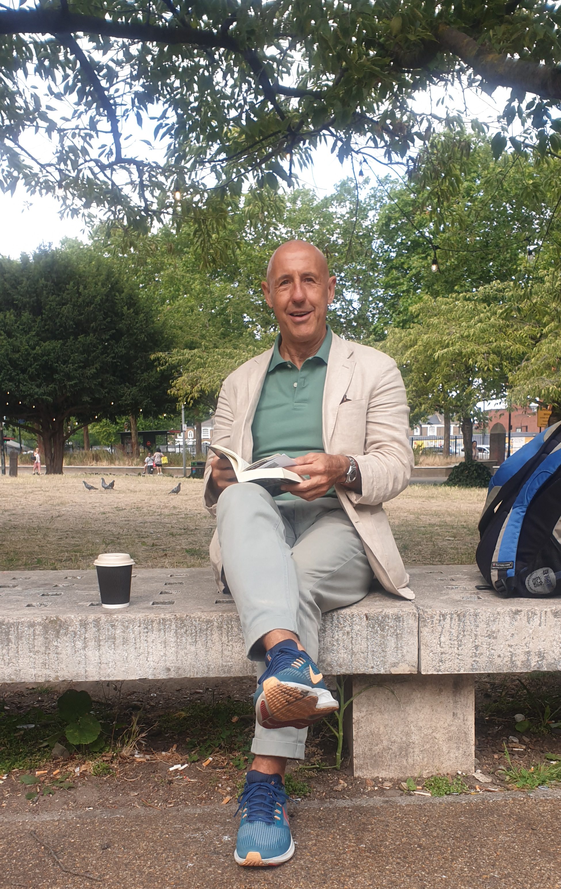 Enjoying a coffee and a read at St Paul's Green